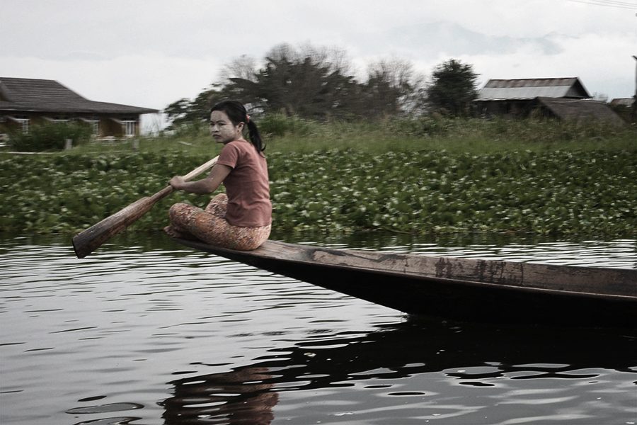 girl rowing in Inle Lake in Myanmar