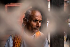 A man reading scriptures at Pashupatinath