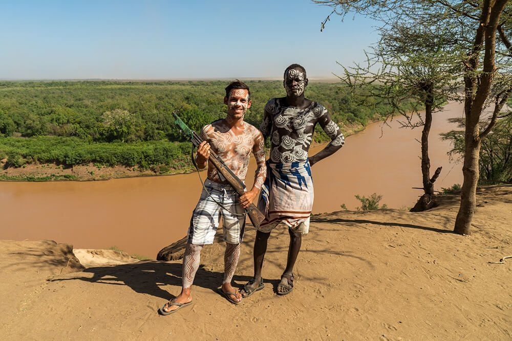 Norbert with a rifle at the Karo tribe