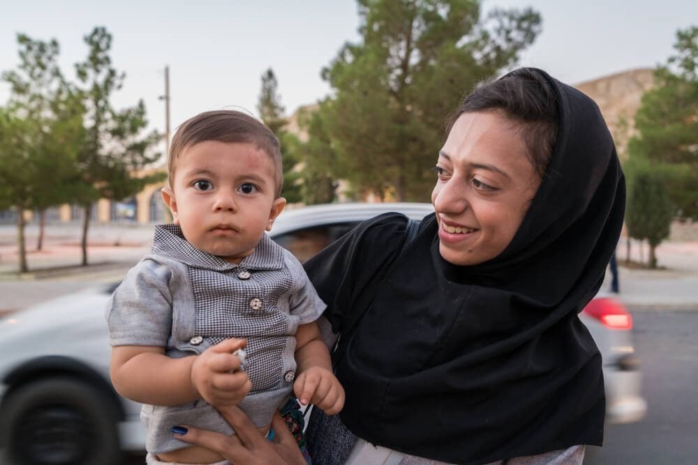 Lady and her baby in Eqlid, Iran